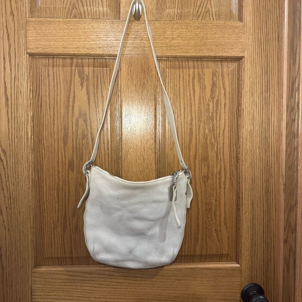 Coach White Leather Crossbody Purse. Adjustable straps. Silver hardware.